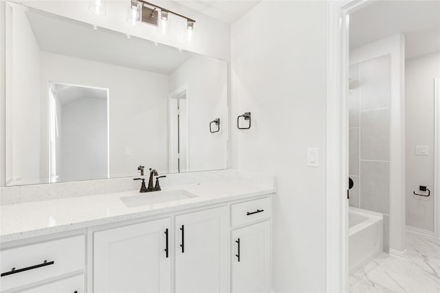 216 Dove Haven Dr, Wylie, TX 75098 - bathroom with marble look tiles, vanity, bathing tub / shower combination, and baseboards