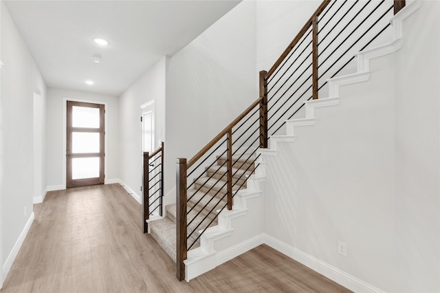 216 Dove Haven Dr, Wylie, TX 75098 - entrance foyer with light wood finished floors, baseboards, recessed lighting, and stairway