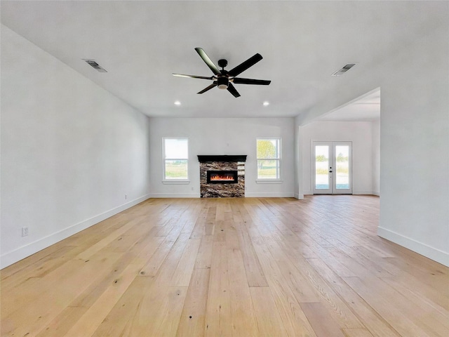 114 Trailridge Dr, Corsicana, TX 75110 - unfurnished living room featuring baseboards, visible vents, light wood-style floors, and ceiling fan
