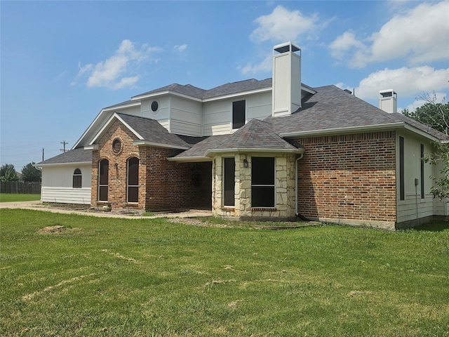 20009 Sedalia Trl, Frisco, TX 75036 - view of front facade featuring a chimney, a front yard, and brick siding