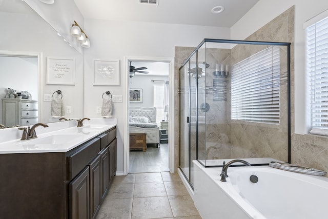 1753 Rio Penasco Rd, Fort Worth, TX 76052 - ensuite bathroom featuring a bath, a shower stall, double vanity, ceiling fan, and tile patterned flooring