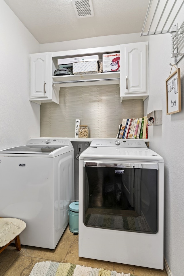1753 Rio Penasco Rd, Fort Worth, TX 76052 - washroom with cabinet space and washing machine and clothes dryer