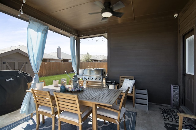 1753 Rio Penasco Rd, Fort Worth, TX 76052 - fenced backyard featuring outdoor dining area, a storage shed, a patio area, a ceiling fan, and area for grilling