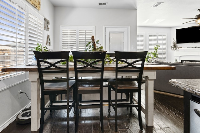 1753 Rio Penasco Rd, Fort Worth, TX 76052 - dining area featuring a ceiling fan, wood-type flooring, and a fireplace