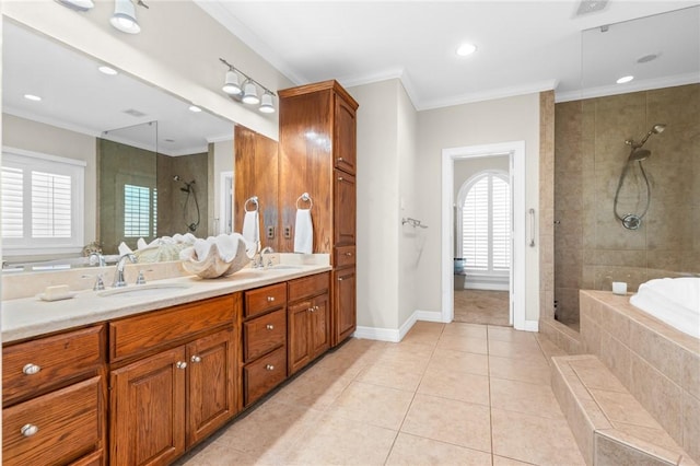 8 Republic Dr, Waco, TX 76708 - bathroom featuring tiled shower, double vanity, a bath, ornamental molding, and tile patterned flooring