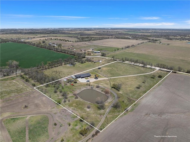 birds eye view of property featuring a rural view