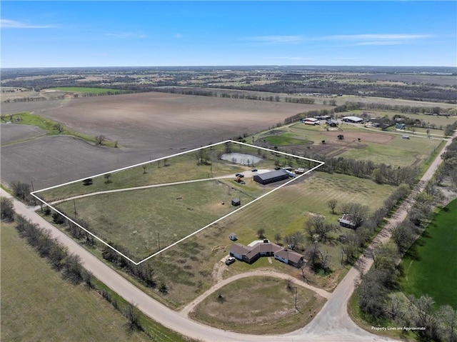 birds eye view of property featuring a rural view