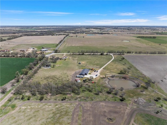 birds eye view of property with a rural view
