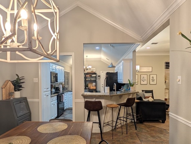 kitchen with blue cabinetry, black appliances, lofted ceiling, and ornamental molding