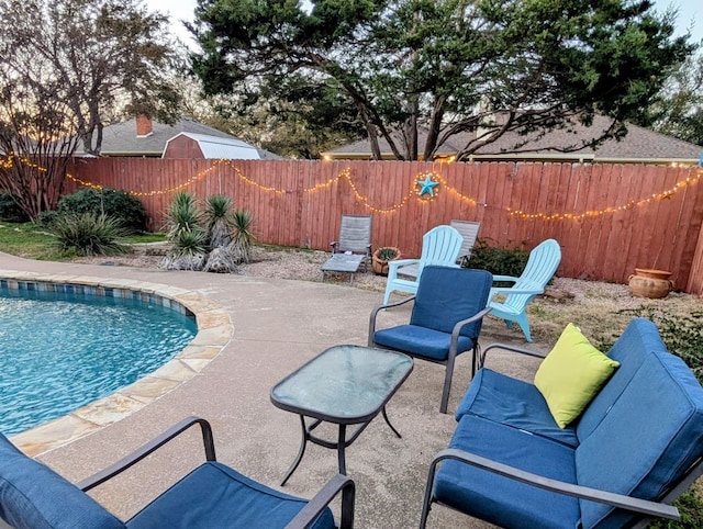 view of pool featuring a fenced in pool, a patio, and a fenced backyard