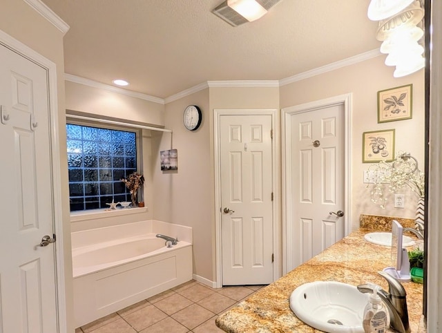 bathroom with a sink, visible vents, a bath, and tile patterned flooring