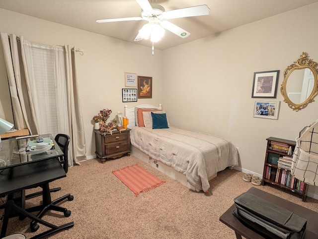 carpeted bedroom featuring a ceiling fan and baseboards
