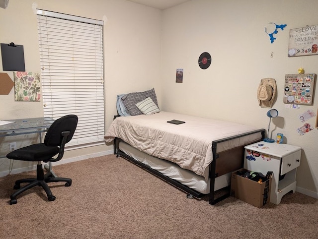 carpeted bedroom with baseboards