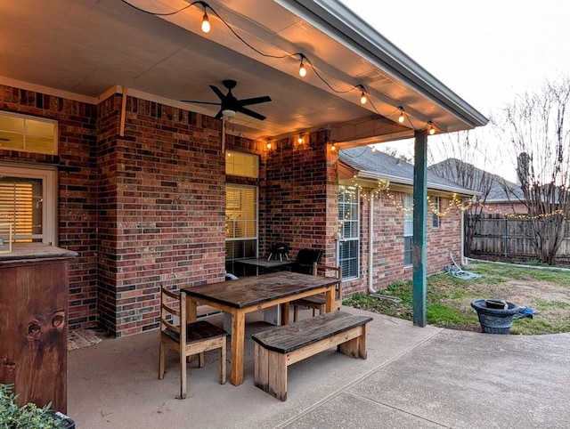 view of patio / terrace featuring outdoor dining area, fence, and ceiling fan