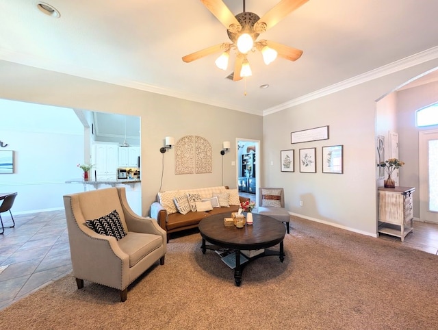 1231 Radisson Dr, Hewitt, TX 76643 - living room with ornamental molding, ceiling fan, baseboards, and light tile patterned floors