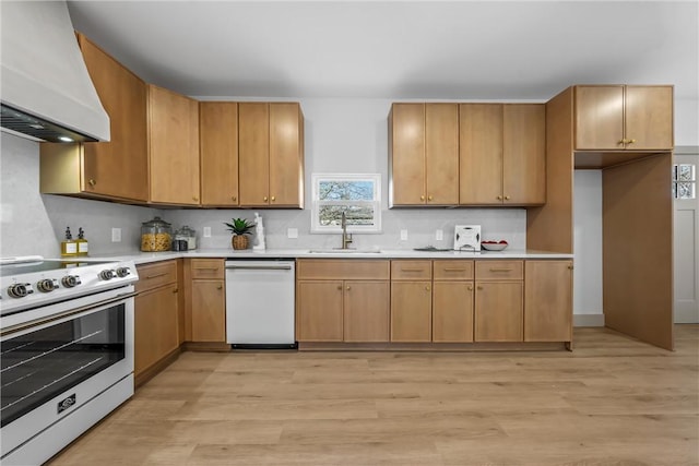 2211 Morrow Ave, Waco, TX 76707 - kitchen featuring white appliances, a sink, range hood, light countertops, and light wood-type flooring