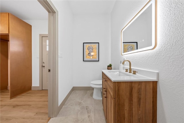 2211 Morrow Ave, Waco, TX 76707 - bathroom with vanity, toilet, and baseboards