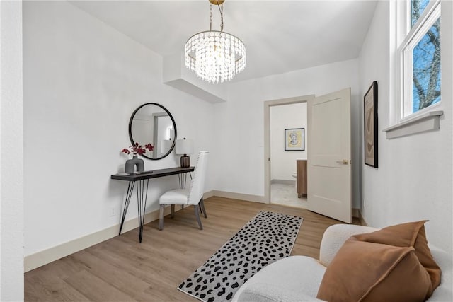 2211 Morrow Ave, Waco, TX 76707 - entrance foyer with light wood finished floors, a chandelier, plenty of natural light, and baseboards