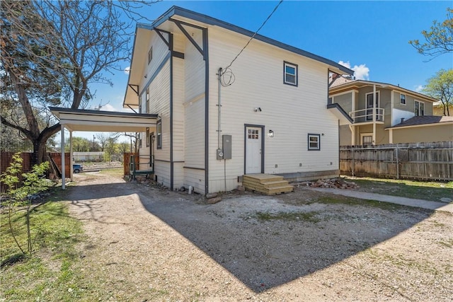 2211 Morrow Ave, Waco, TX 76707 - rear view of property with fence and a carport