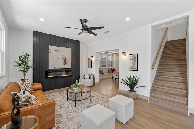 2211 Morrow Ave, Waco, TX 76707 - living area with light wood-style floors, a ceiling fan, stairway, recessed lighting, and a fireplace