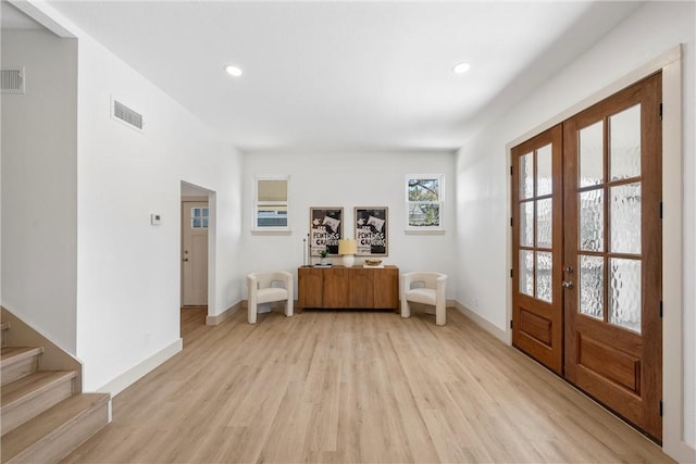 2211 Morrow Ave, Waco, TX 76707 - foyer featuring french doors, light wood-style flooring, baseboards, recessed lighting, and stairs