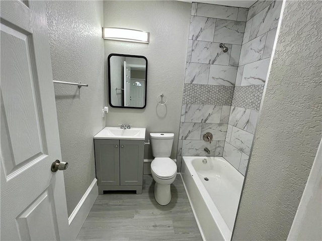 310 N Lakeview Dr, Lacy Lakeview, TX 76705 - full bath featuring wood finished floors, vanity, toilet, tub / shower combination, and a textured wall