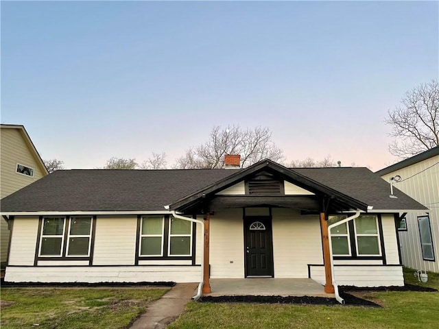 310 N Lakeview Dr, Lacy Lakeview, TX 76705 - single story home featuring a front yard, a shingled roof, covered porch, and a chimney