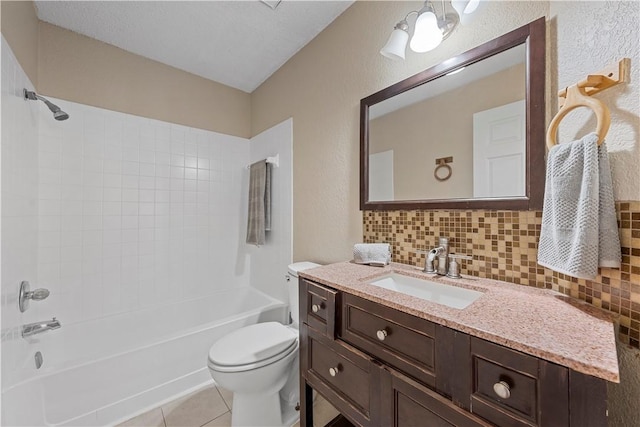1901 Ruidoso Dr, Waco, TX 76712 - bathroom featuring toilet, vanity, backsplash, shower / bathtub combination, and a textured wall