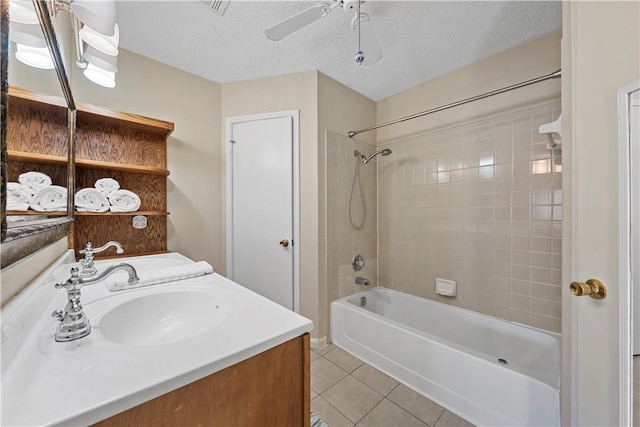 1901 Ruidoso Dr, Waco, TX 76712 - bathroom featuring tile patterned floors, shower / bath combination, a textured ceiling, vanity, and a ceiling fan