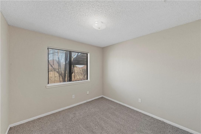 1901 Ruidoso Dr, Waco, TX 76712 - spare room with carpet flooring, baseboards, and a textured ceiling