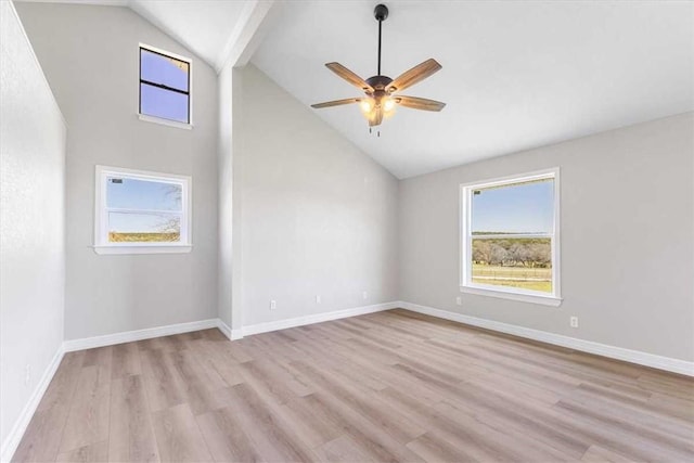 unfurnished room featuring baseboards, light wood-type flooring, and a ceiling fan