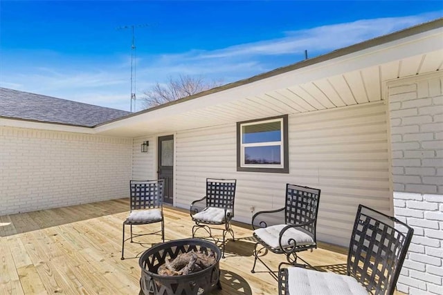deck featuring a fire pit
