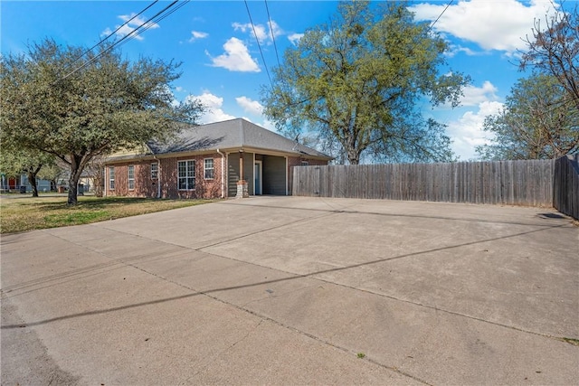 2124 S 4th St, Waco, TX 76706 - view of front of house with brick siding, driveway, a front yard, and fence