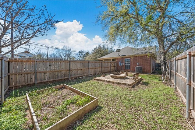 2124 S 4th St, Waco, TX 76706 - view of yard with a fire pit, cooling unit, a fenced backyard, and a vegetable garden