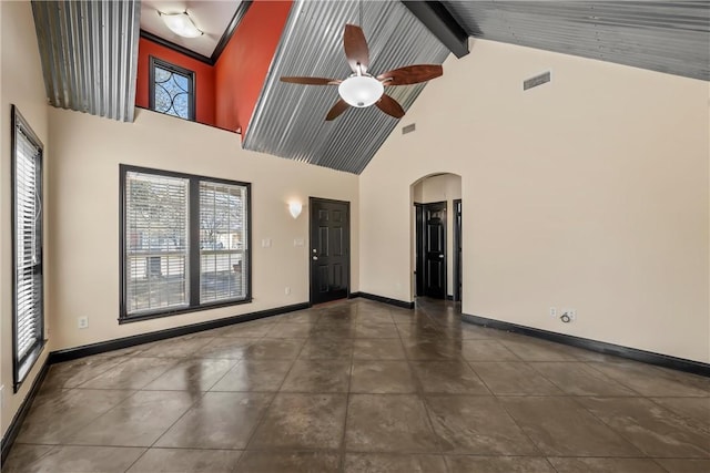 2124 S 4th St, Waco, TX 76706 - empty room featuring visible vents, a ceiling fan, arched walkways, beam ceiling, and high vaulted ceiling
