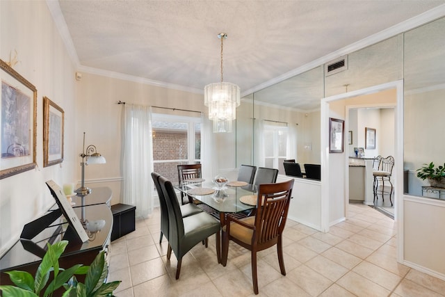 dining area featuring crown molding, a notable chandelier, visible vents, and light tile patterned floors