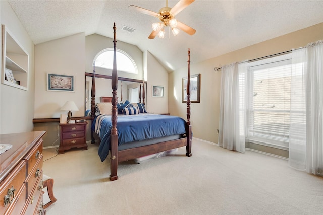 bedroom with baseboards, visible vents, vaulted ceiling, a textured ceiling, and light carpet