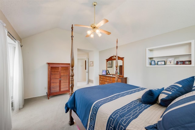 bedroom featuring a ceiling fan, lofted ceiling, light colored carpet, and visible vents