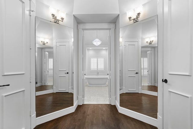 7607 Monticello Pkwy, Colleyville, TX 76034 - full bath with a soaking tub, baseboards, and wood finished floors