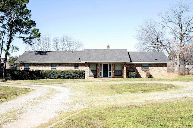 5204 Mansfield Rd, Arlington, TX 76017 - ranch-style house with brick siding, driveway, a chimney, and a front lawn