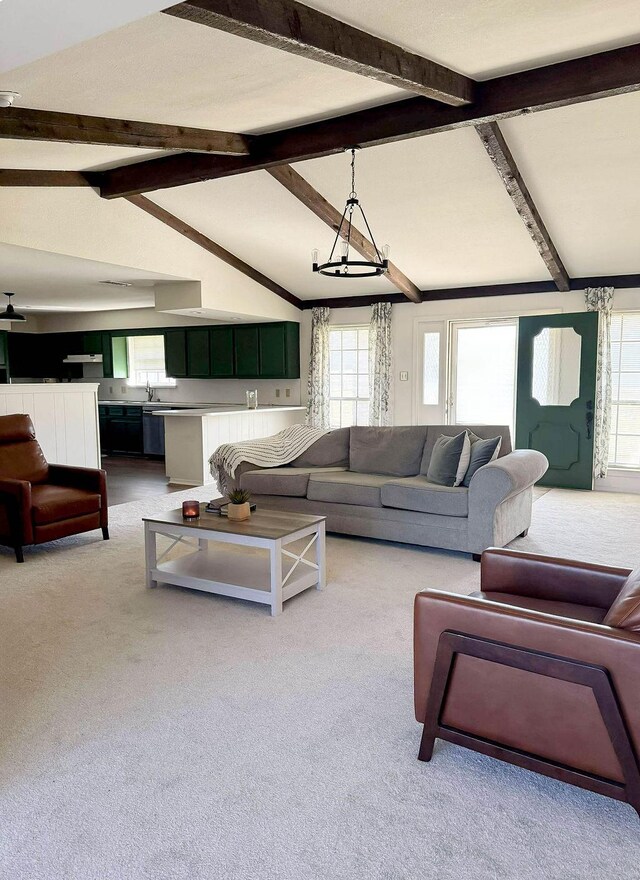 5204 Mansfield Rd, Arlington, TX 76017 - carpeted living room featuring plenty of natural light and vaulted ceiling with beams