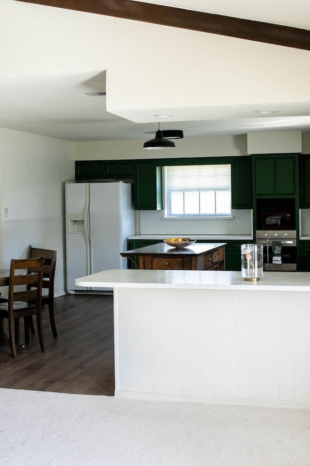 5204 Mansfield Rd, Arlington, TX 76017 - kitchen featuring oven, visible vents, wood finished floors, white fridge with ice dispenser, and light countertops