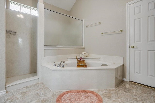 full bathroom featuring a bath and a shower