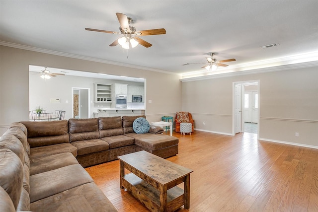 2212 Summit Dr, Burleson, TX 76028 - living room with ceiling fan, ornamental molding, light wood-type flooring, and baseboards