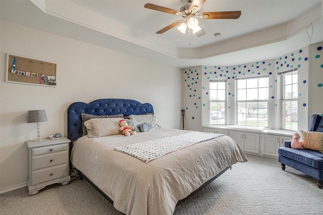 bedroom with light carpet and a ceiling fan