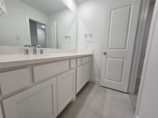 2856 Chester Dr, Celina, TX 75009 - bathroom with tile patterned floors, baseboards, and vanity