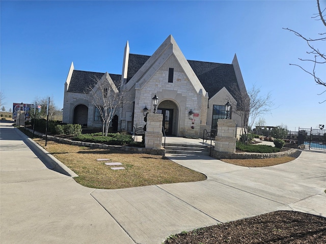 2856 Chester Dr, Celina, TX 75009 - french country style house featuring fence and stone siding