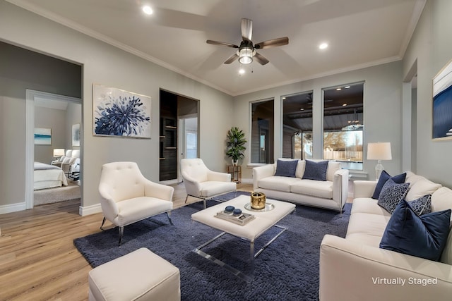 living room featuring baseboards, recessed lighting, a ceiling fan, wood finished floors, and ornamental molding