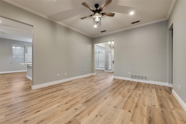 spare room with light wood-type flooring, crown molding, visible vents, and ceiling fan with notable chandelier