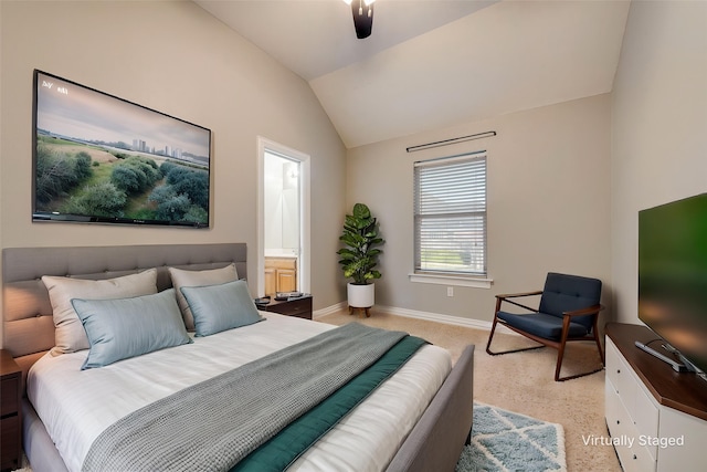 bedroom featuring light carpet, vaulted ceiling, and baseboards